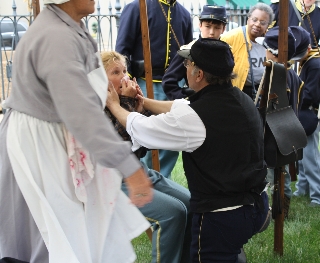 The Surgeon discovers a female in the camp  